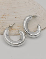 curved silver earrings crescent moon style montreal minimalist jewelry