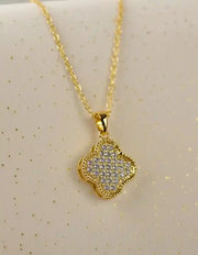Layering necklace with black and gold reversible pendant