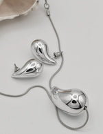 molten_pebble_silver_duo_set_artistic_silver_drop_necklace_and_earrings_montreal