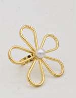 Dainty pearl ring layered with minimalist gold jewellery