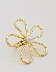 Dainty pearl ring layered with minimalist gold jewellery