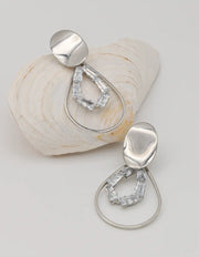 close up of gold dangly earrings featuring clear baguette crystals, montreal jewellery gift for her