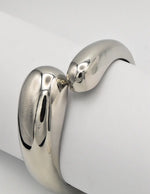 silver metallic chunky bangle bracelet with modern clasp close-up