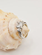 princess_cut_engagement_ring with side stones montreal minimalist style