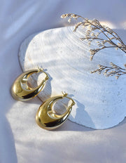 sculpted gold earrings Canada with polished oval drop shape

