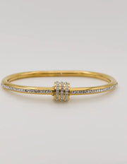 Gold bangle with triple-ring silver-stone centre design
