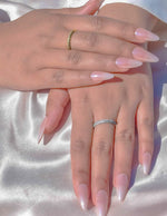 Close-up of diamond glow gold and silver wedding band ring